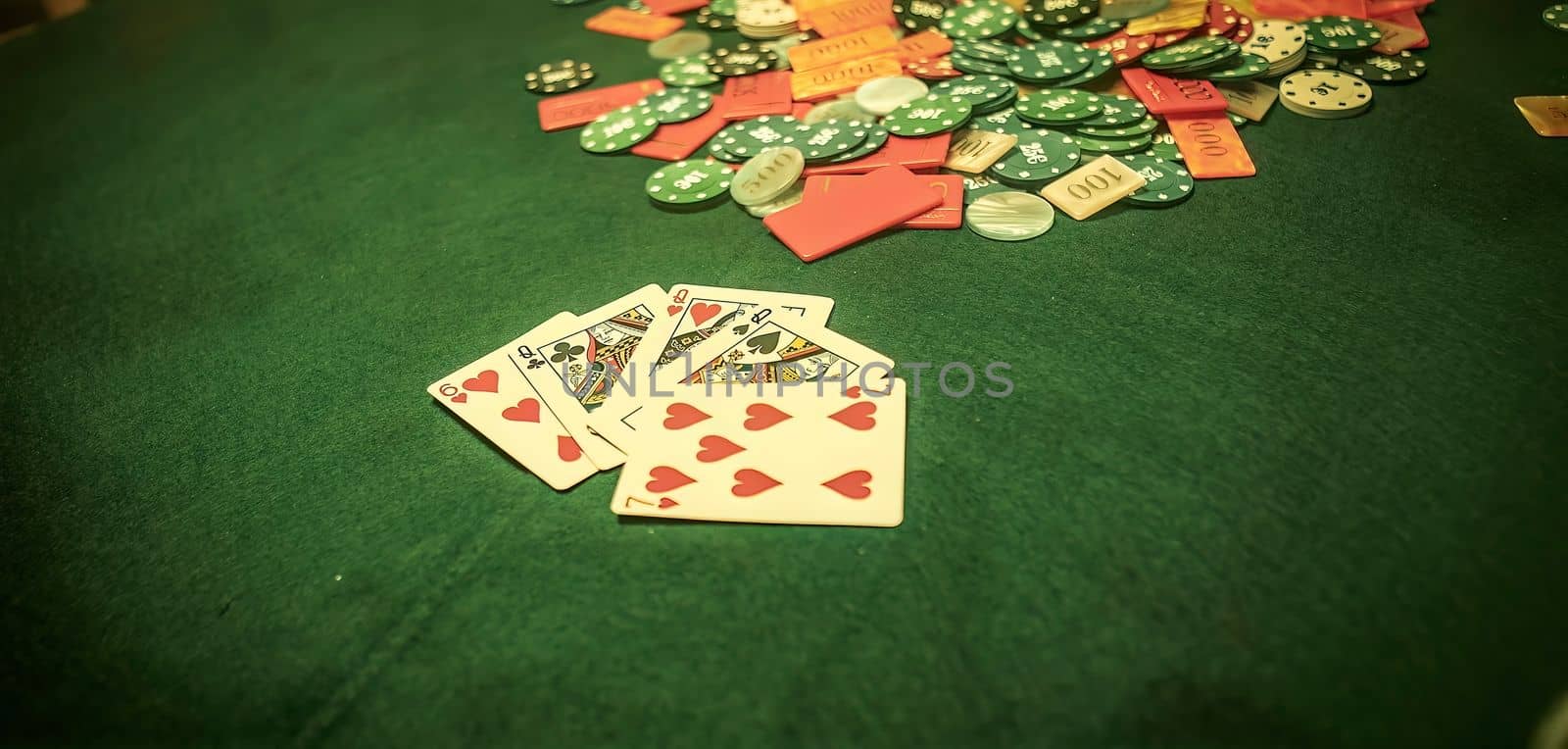 Chaotic scene of poker game with scattered chips on table hinting at high stakes by pippocarlot