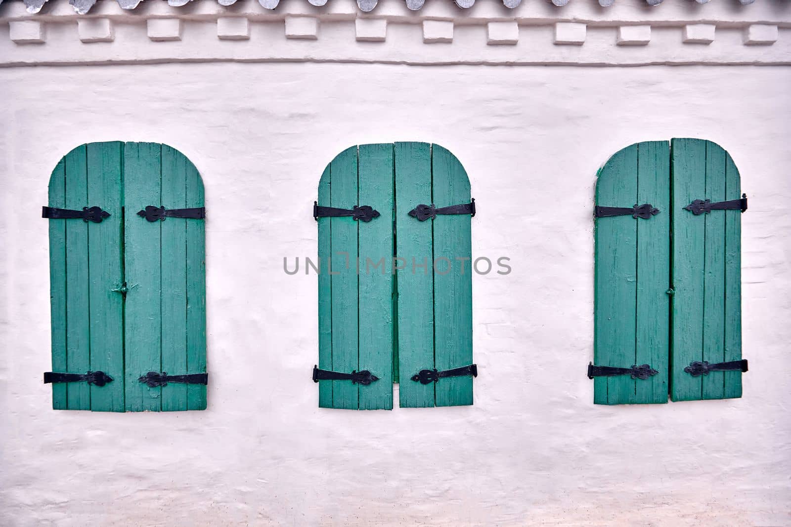 Wooden windows architecture of old wooden houses. Blue wooden window of an old building. Open the shutters blue wood.