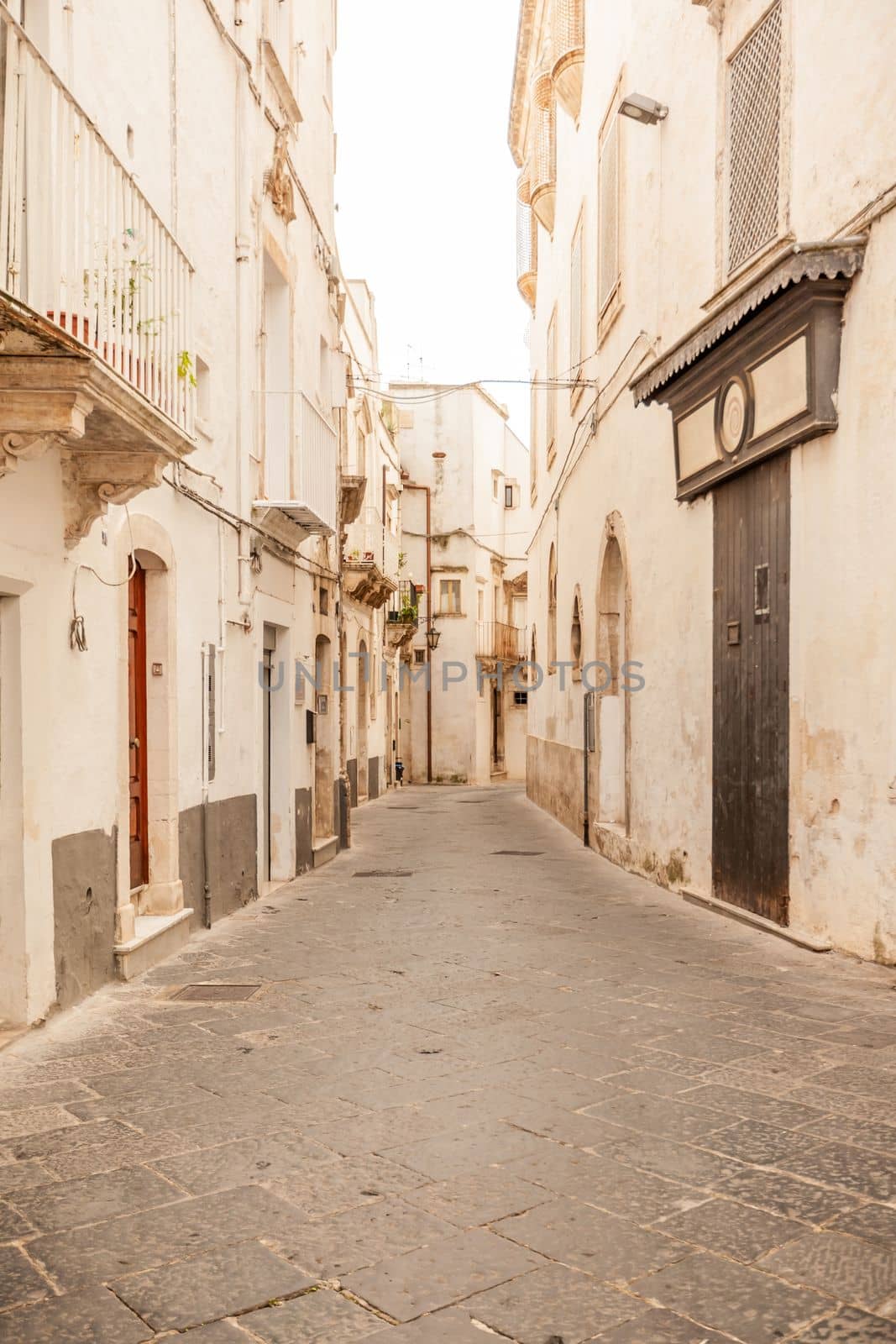 View of the old town of Martina Franca with a beautiful houses painted in white. by nazarovsergey