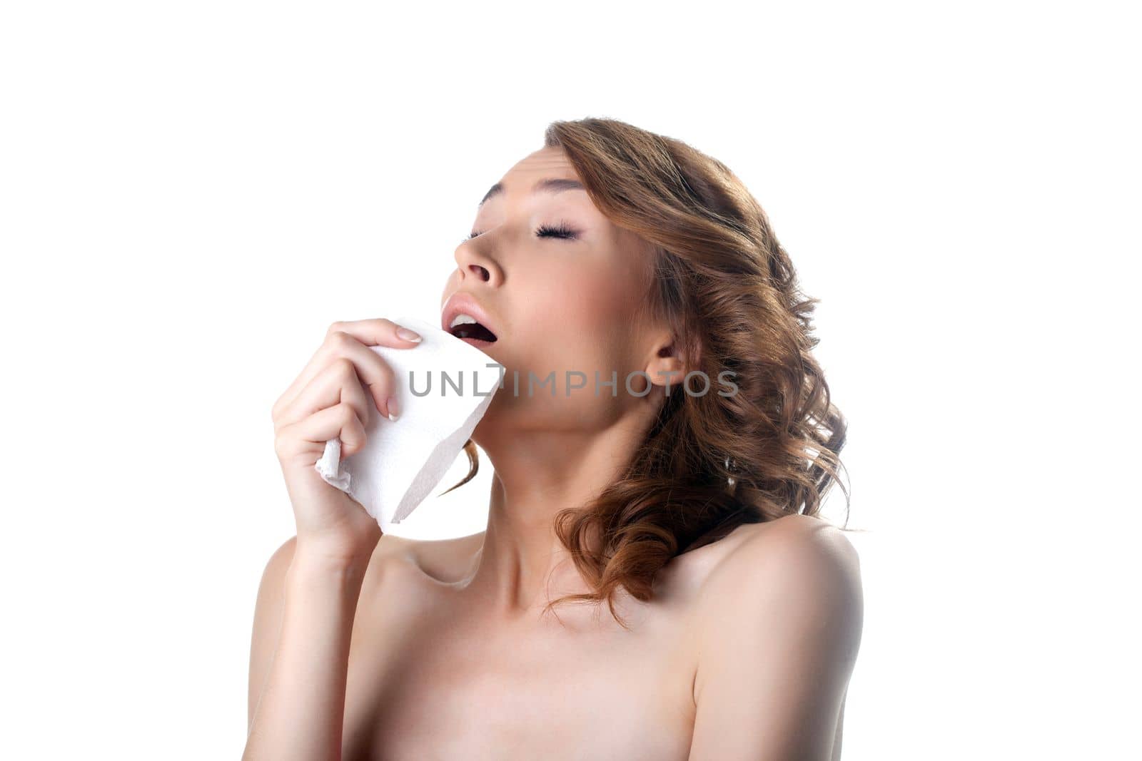 young woman sneezing about illness. Isolated on white