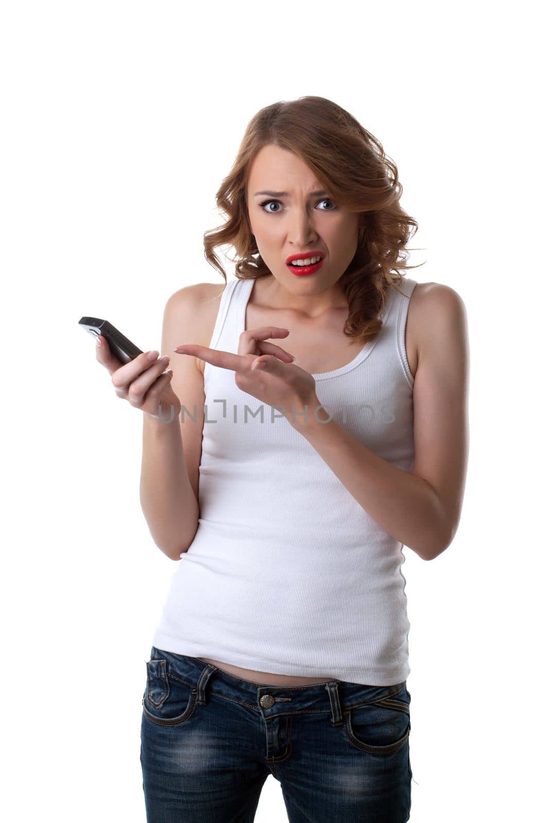 Anger Young woman in tank top point on cell phone isolated