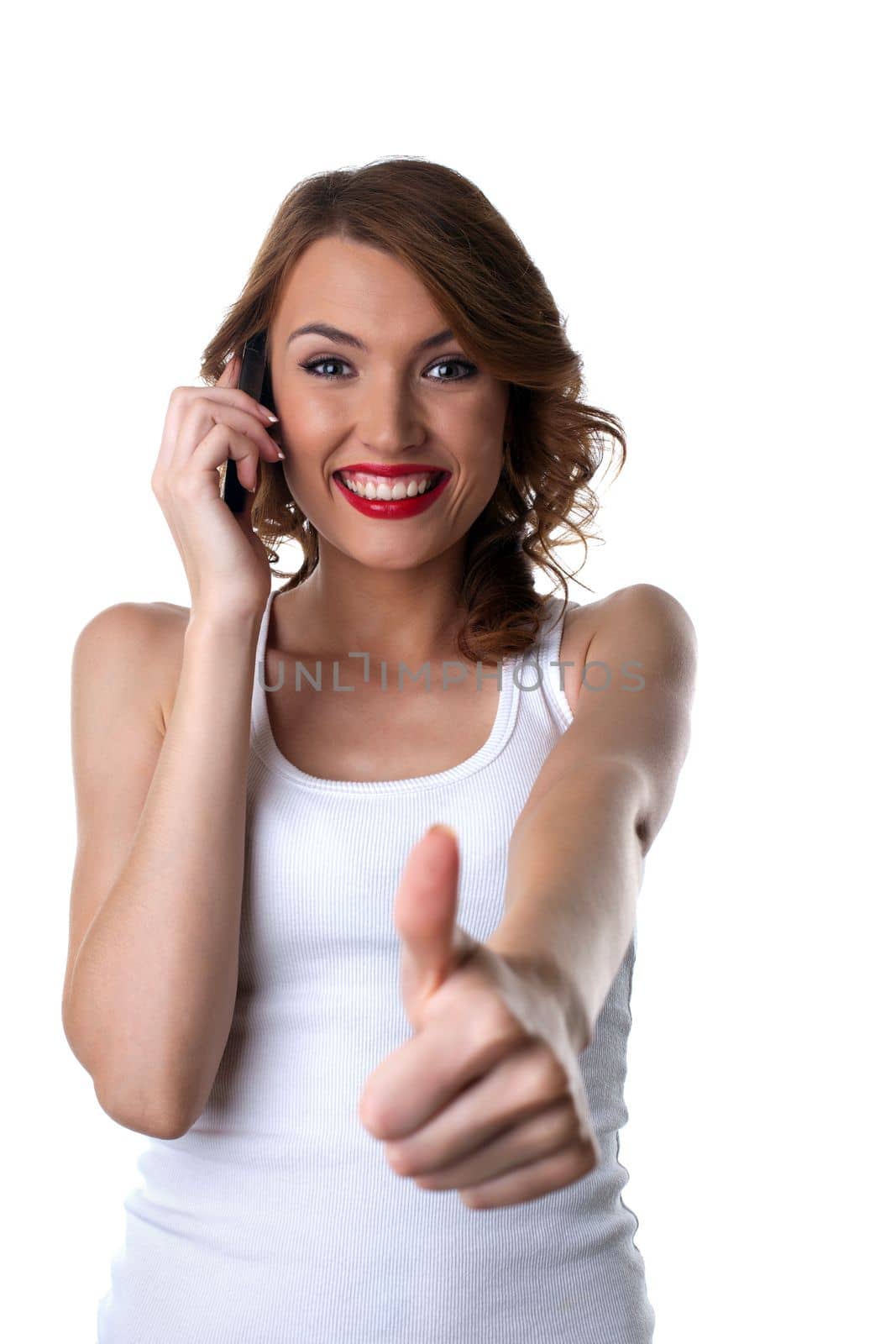 Happy Young woman talk on cell phone and thumbs up isolated