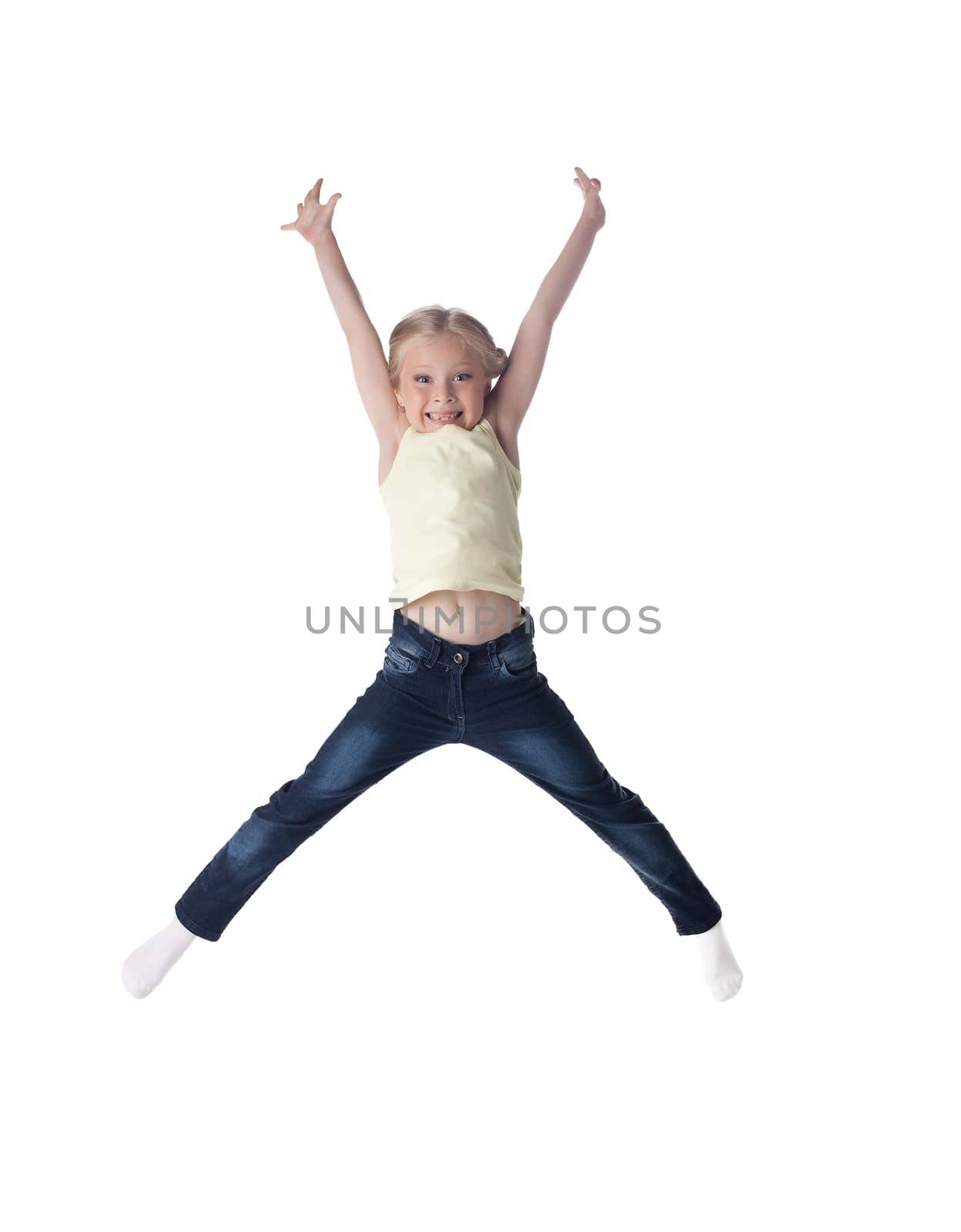 Full length portrait of happy girl in jeans. Isolated on white
