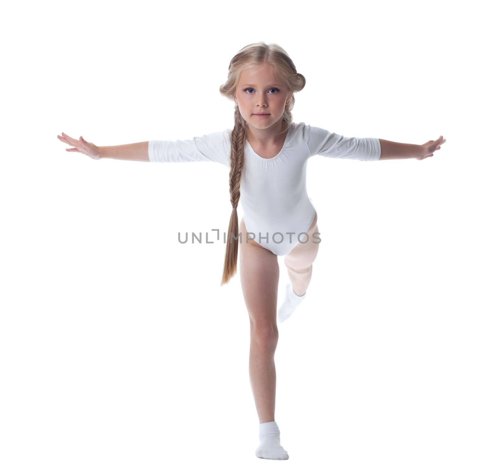 Full length portrait of kid gymnast. Isolated on white