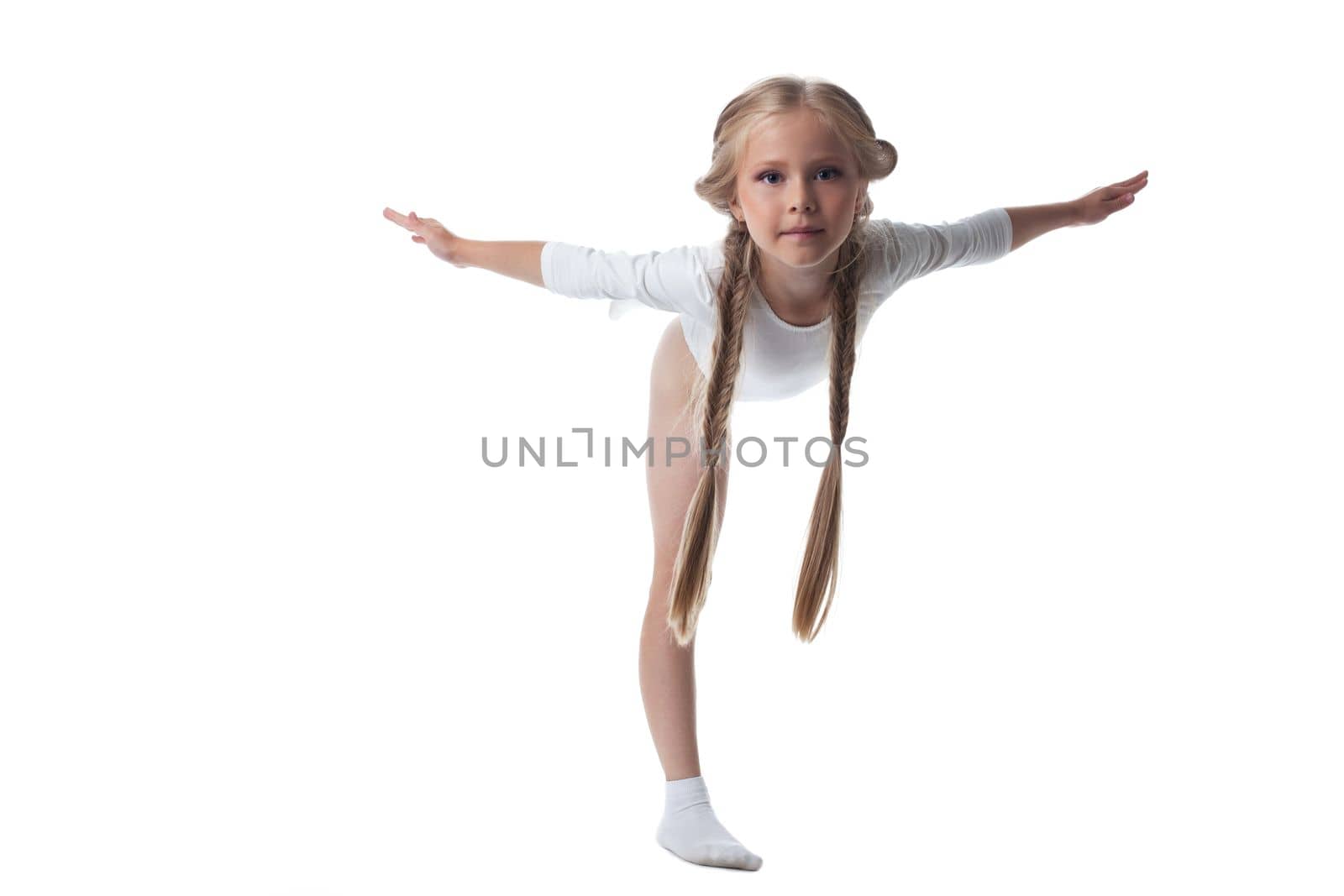 Full length portrait of kid gymnast. Isolated on white