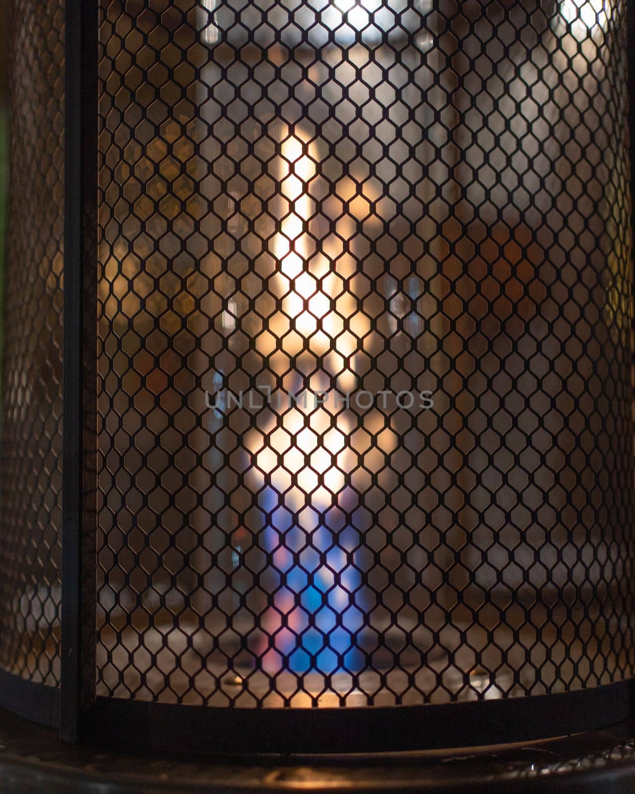 Close up of gas flame heater at night.