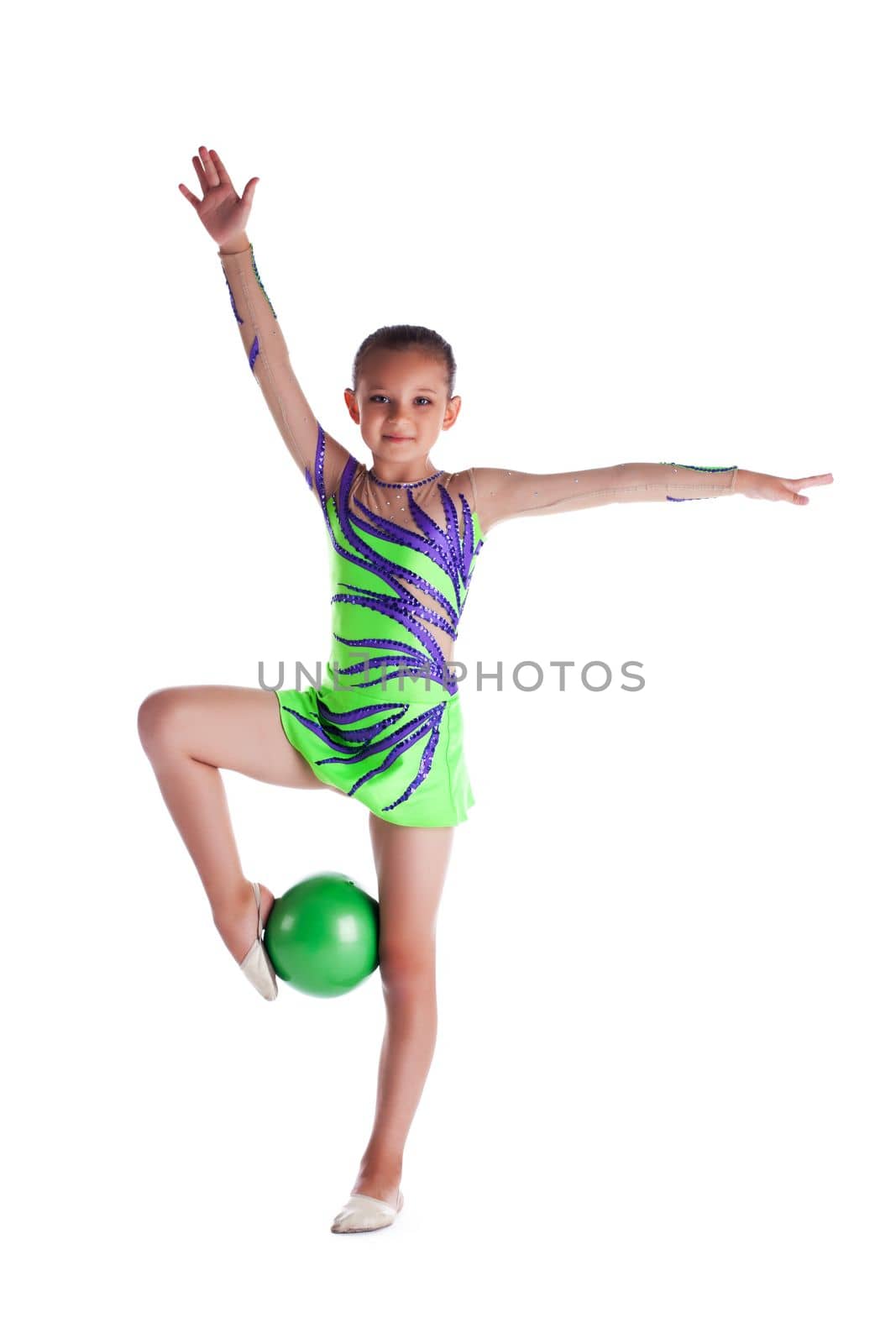 young gymnast stand with green ball isolated
