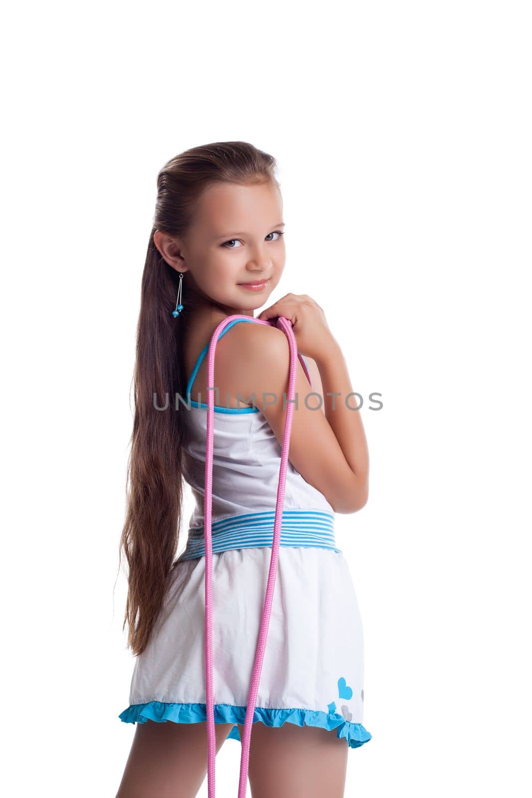 Young teen gymnast posing with skipping rope isolated