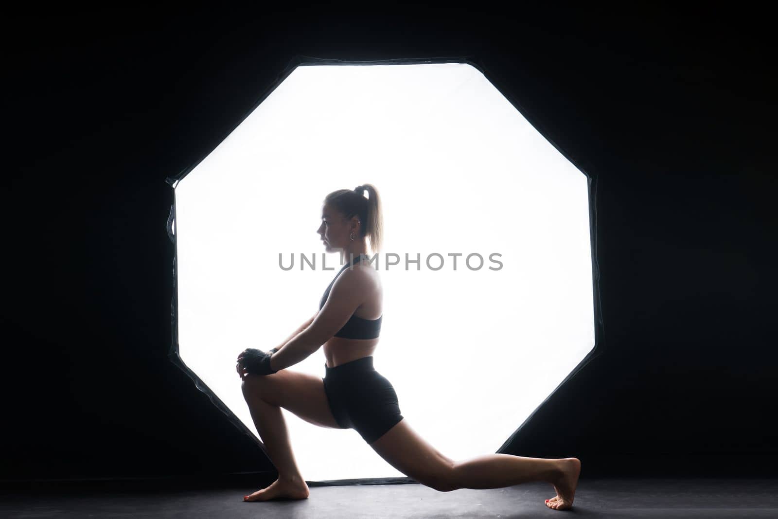 Woman Boxer In Gloves Training On black, red, yellow Background by Zelenin