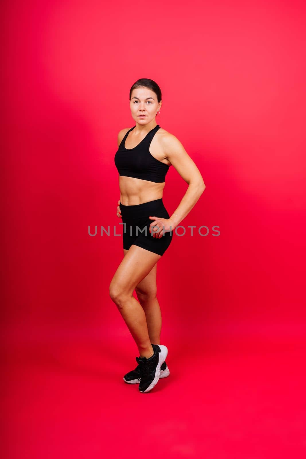 Woman Boxer In Gloves Training On black, red, yellow Background by Zelenin
