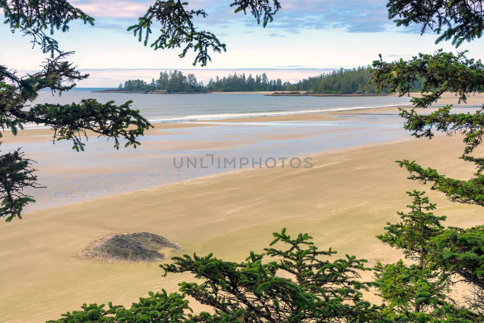 Tidal rise on Pacific ocean long beach near Tofino, British Columbia, Canada.