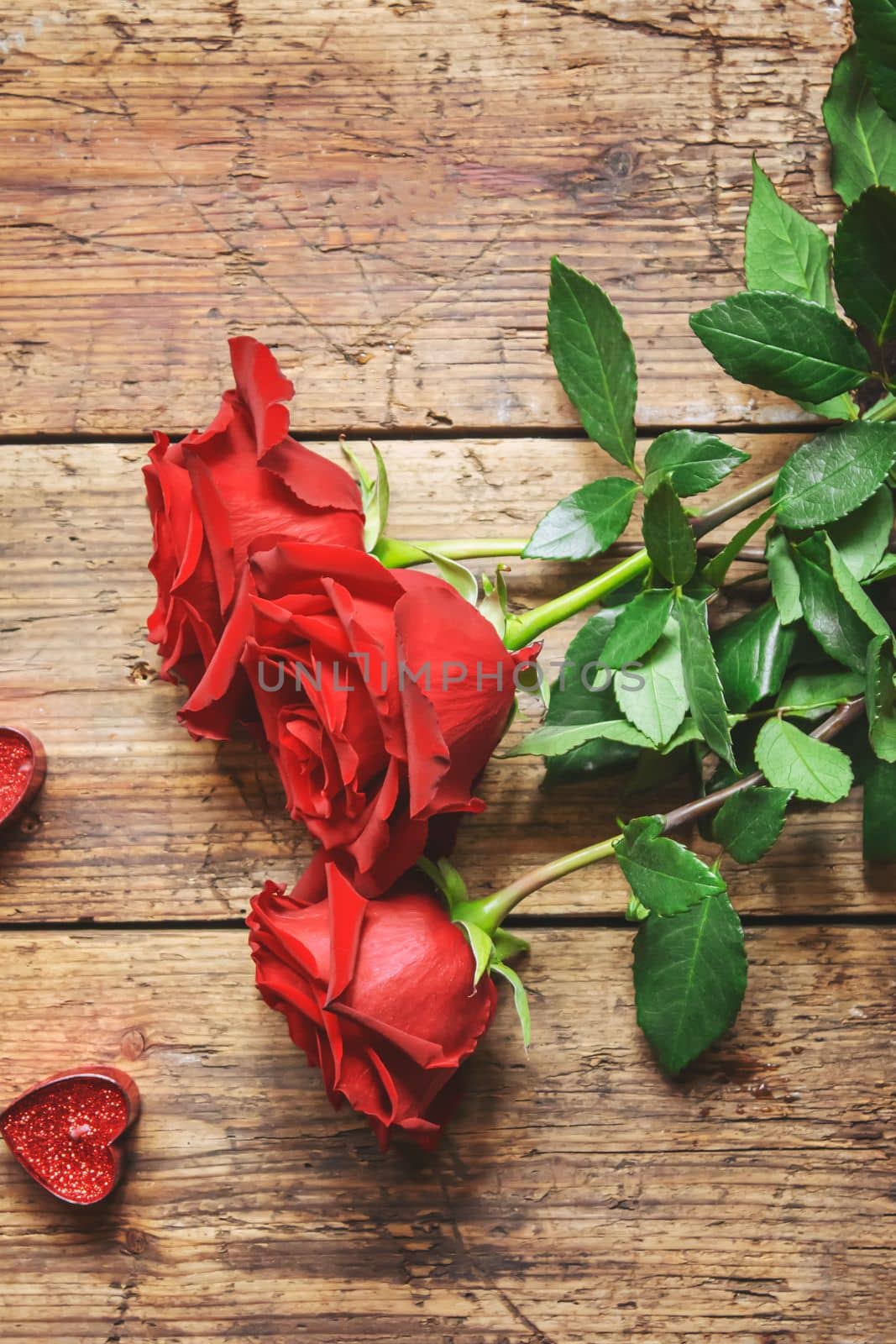 red rose on a wooden background. Valentine's Day gift.selective focus.holiday