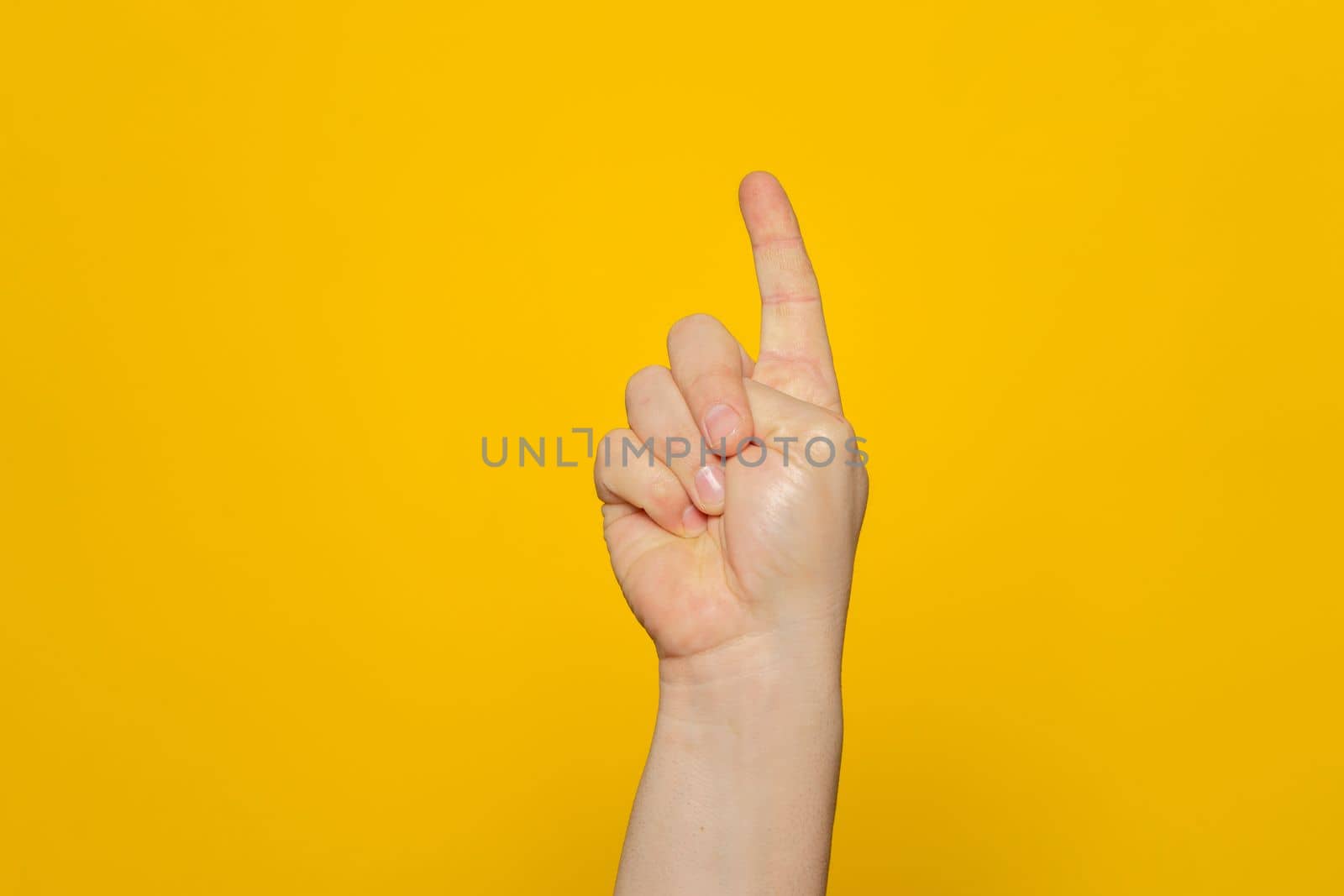 Hand shows index finger isolated on orange background, with clipping path, concept press the button first, double click the mouse, take the elevator
