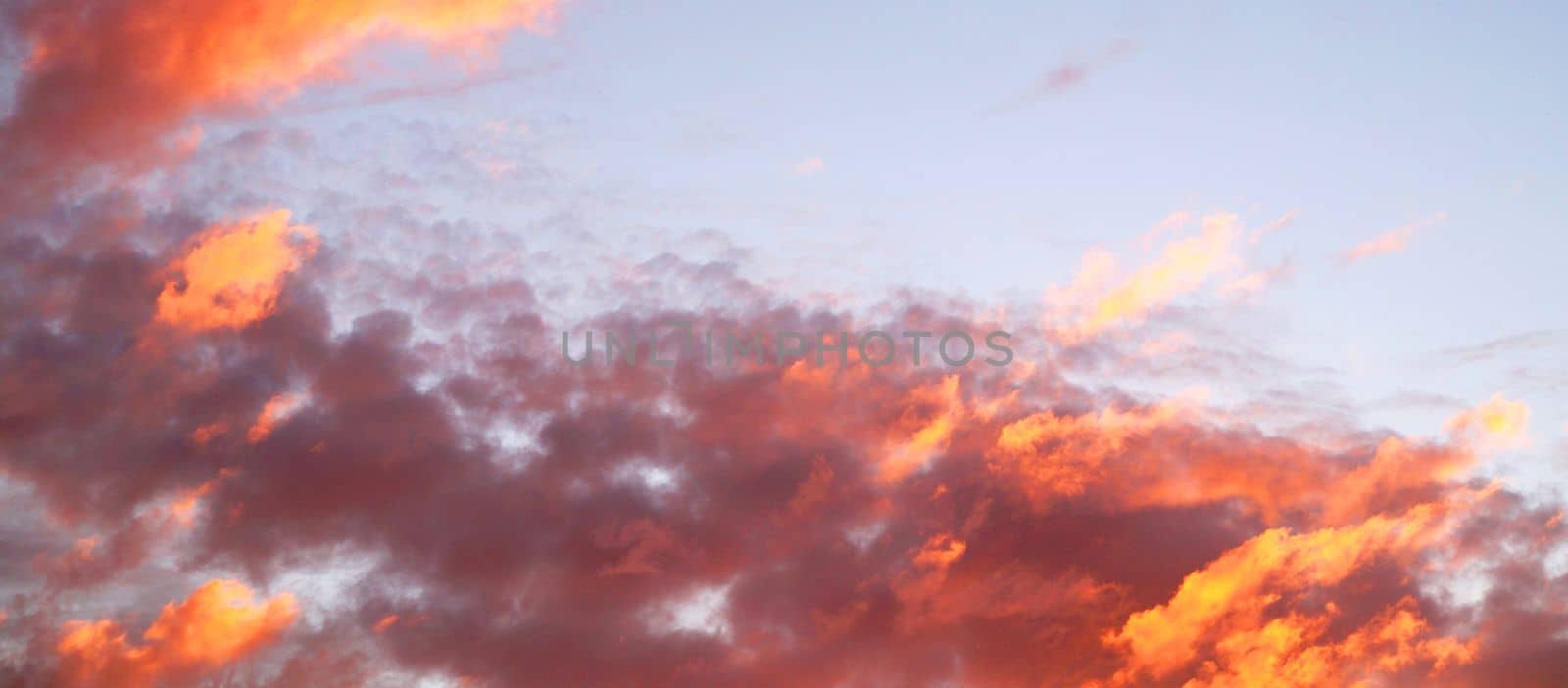 sunset sky with dark orange clouds for horizontal background