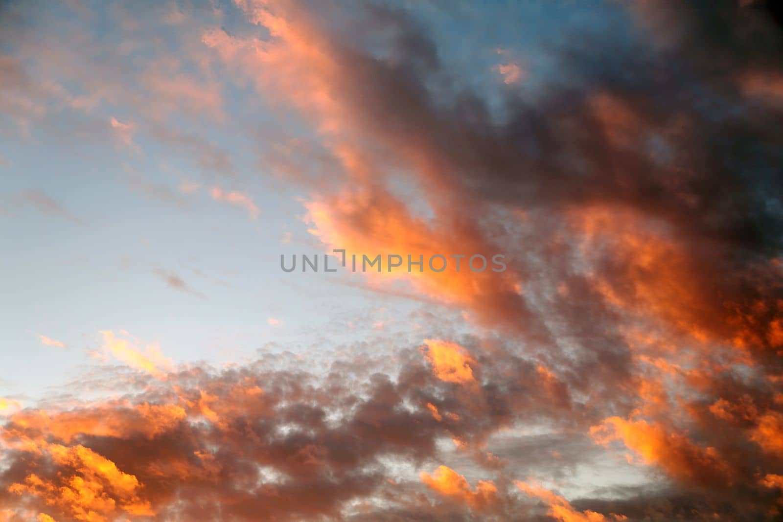 sunset sky with dark orange clouds for background close up