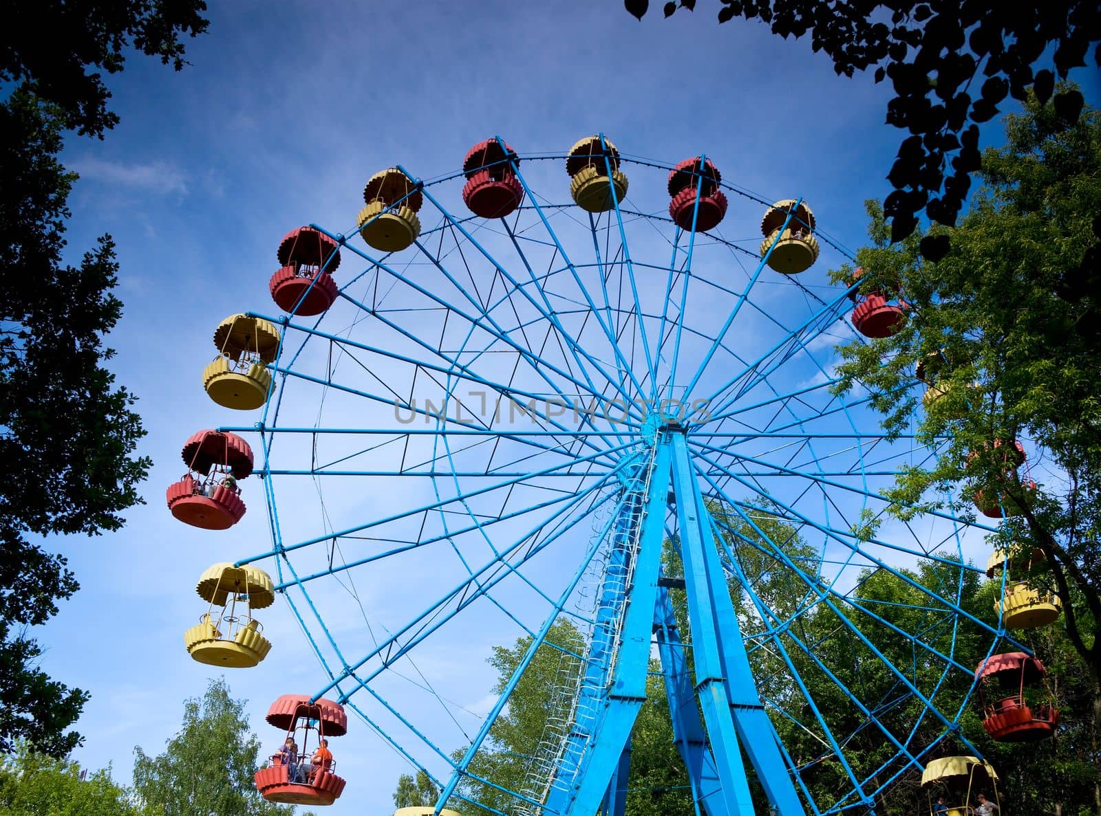 big ferris wheel rotation in summer park