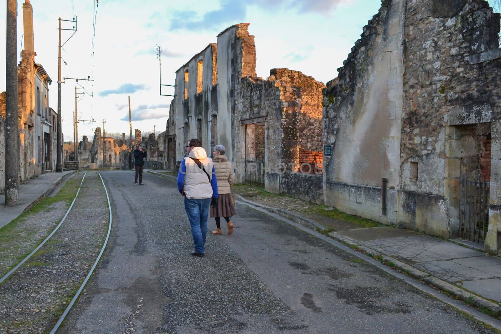 The people near destroyed building during World War 2 in Oradour- sur -Glane France by Godi