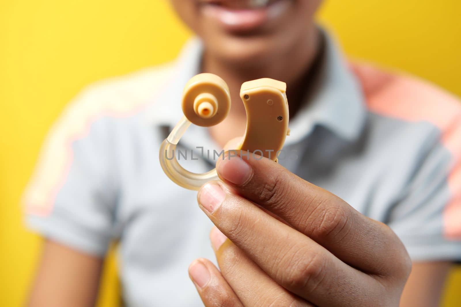 Hearing aid concept, teenage boy with hearing problems.,