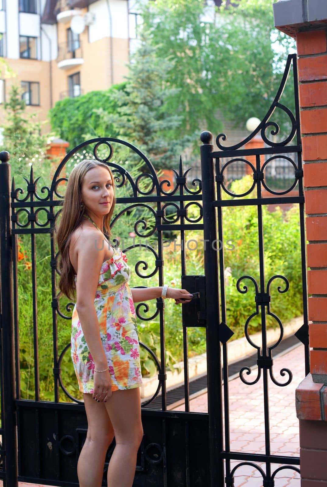 woman in summer dress - welcome to private apartment