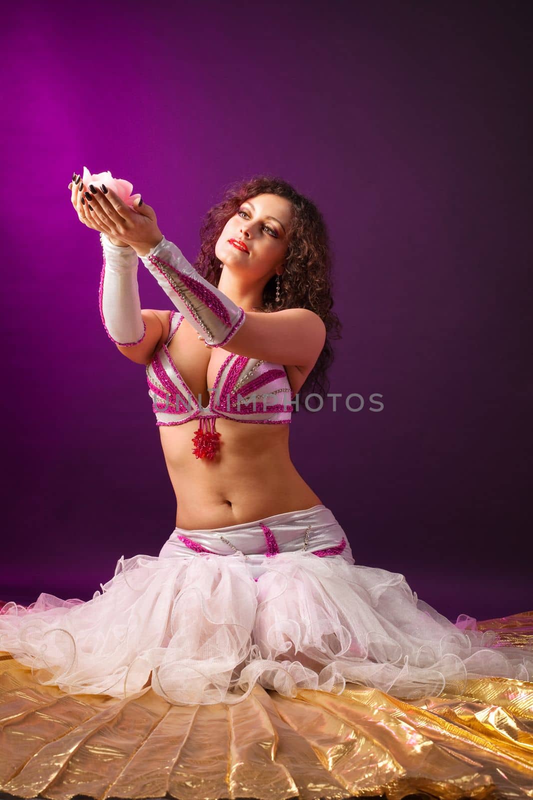 Beauty woman in ballet tutu costume with rose candle