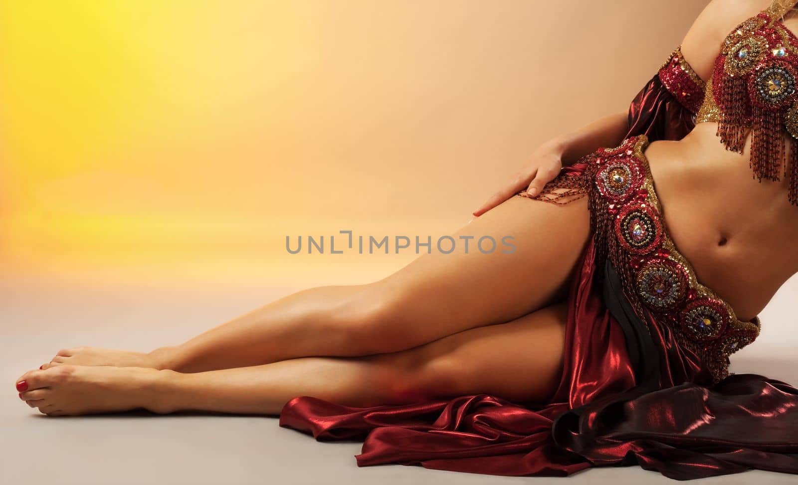 Beauty arabian dancer legs in traditional costume