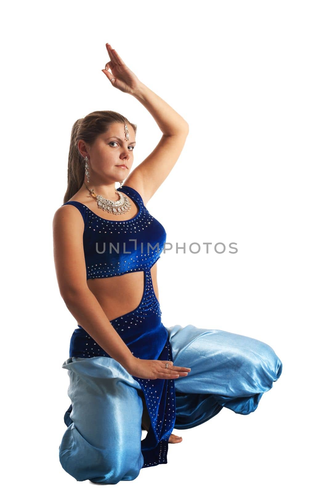 Young woman posing in arabia dance - traditional blue costume