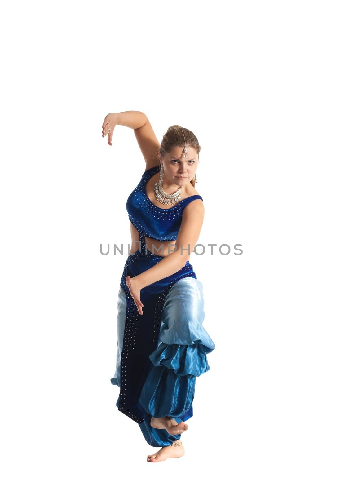 Young woman posing in arabia dance - traditional blue costume