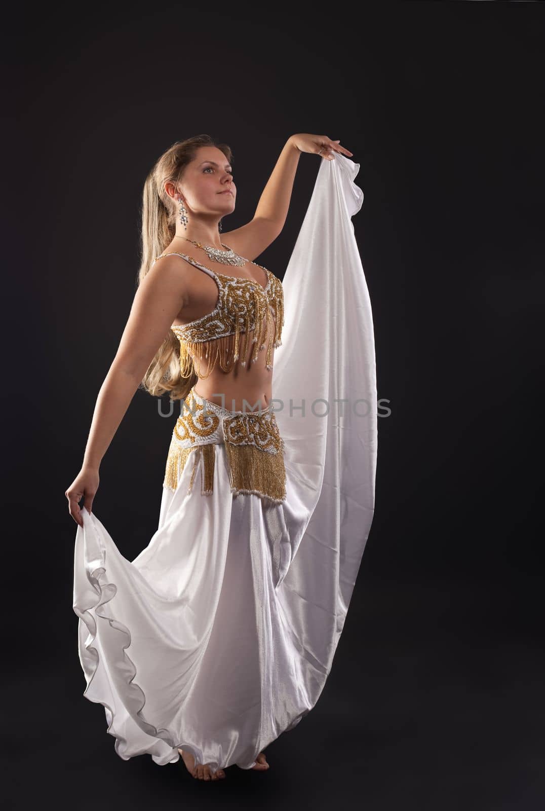 young woman dance in dark - white arabian costume by rivertime