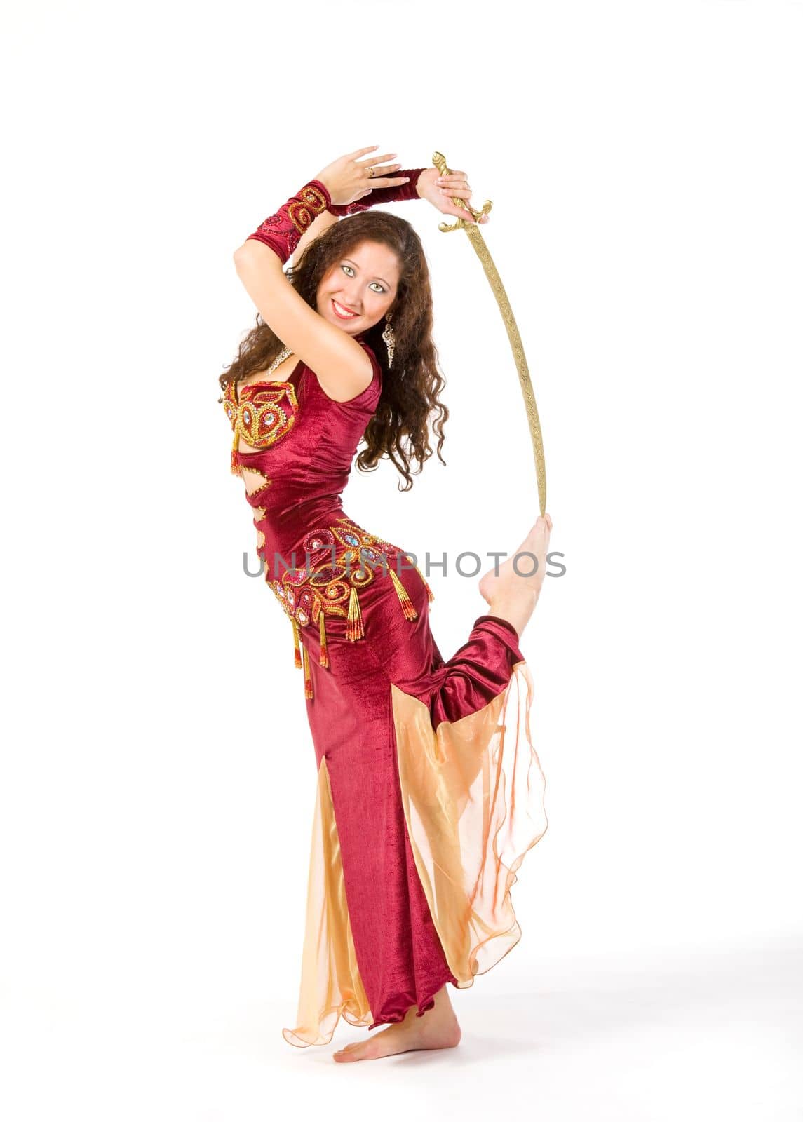 young womand in indian dress dance with sword