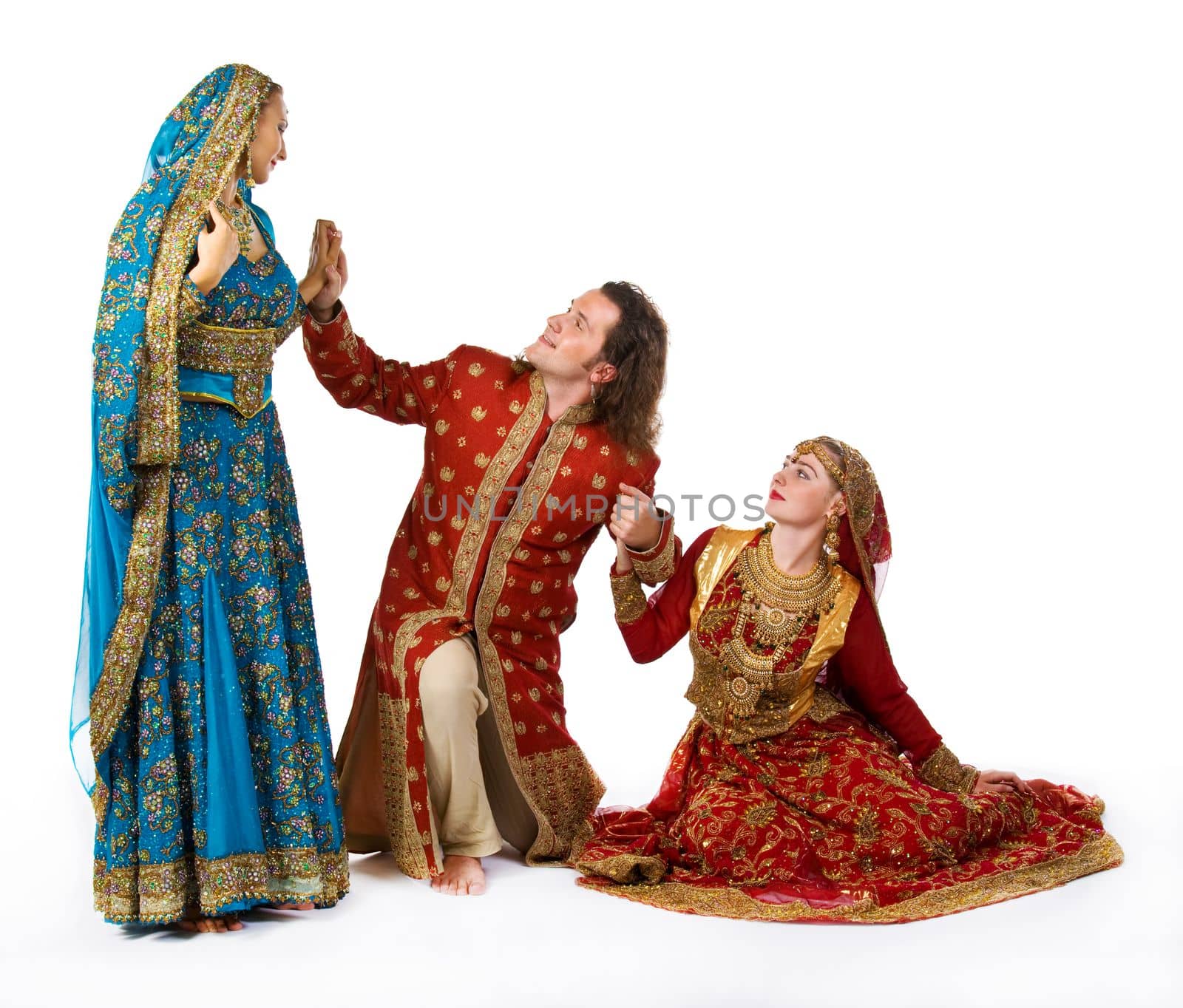 young man with smiling indian girls - traditional costume