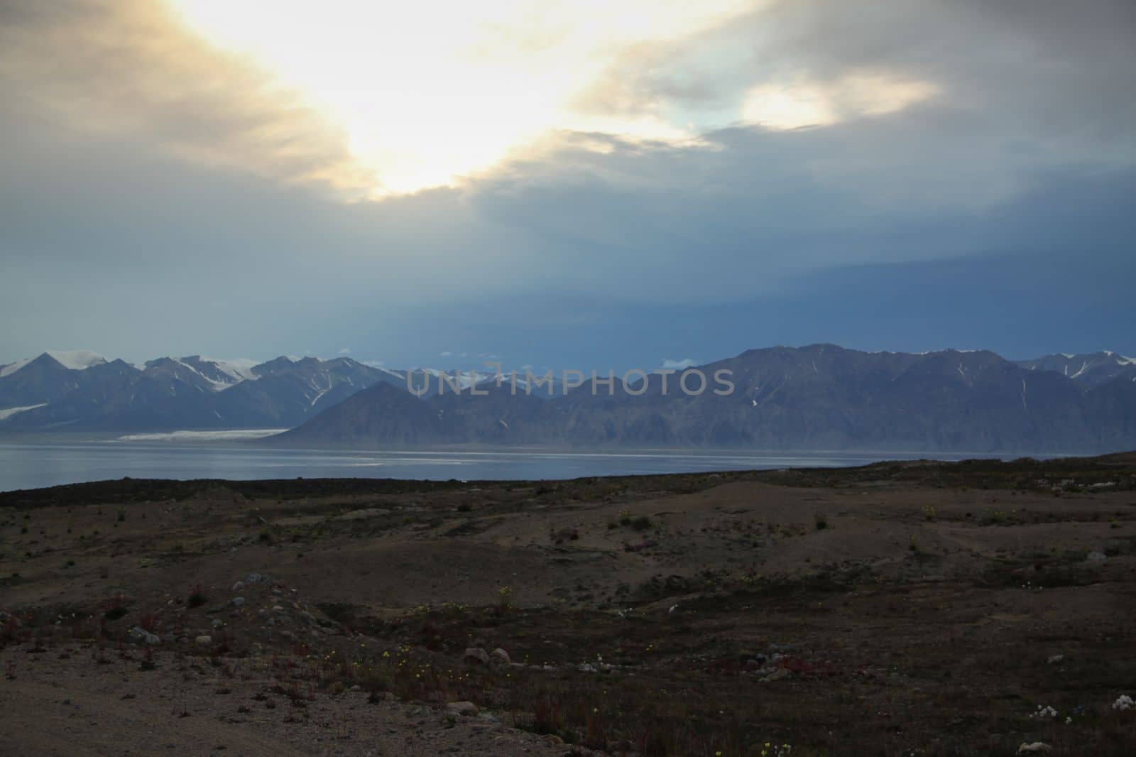 View of mountains across the bay from the community of Pond Inlet, Nunavut, Canada by Granchinho