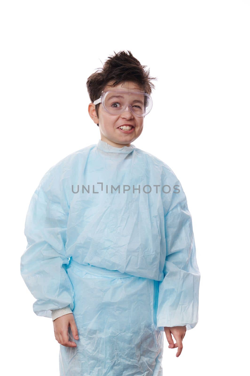 Waist-length emotional portrait on white background, surprised shocked teen nerd schoolboy, young chemist scientist in lab coat and glasses with a chaotic hairstyle, smiling in surprise at the camera