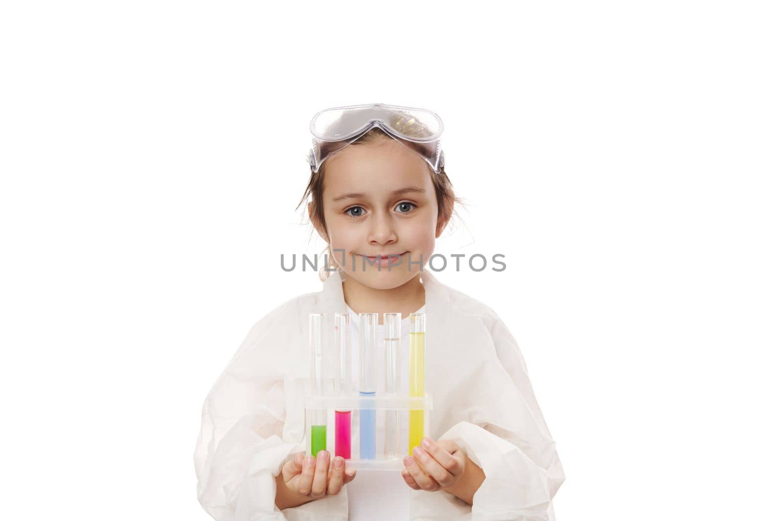 Caucasian smart child girl learning science chemistry, holding test tubes making experiment at school laboratory. Education Science Chemistry and children concept . Early development of children.