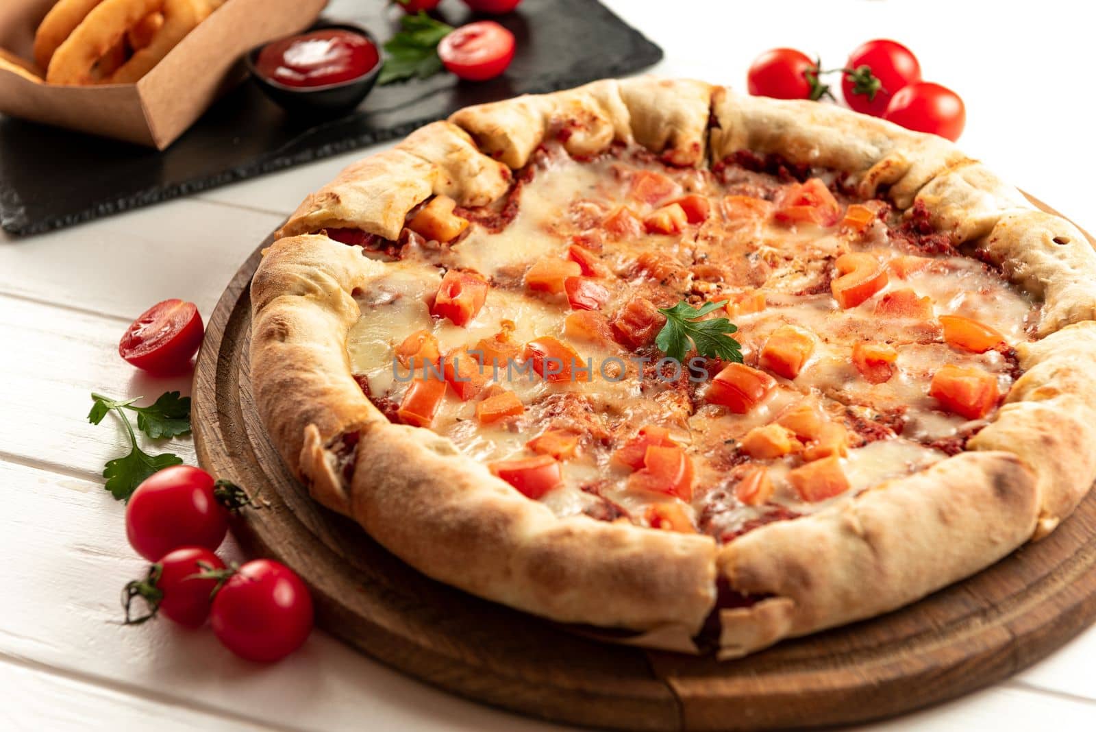 Neapalitan pizza with tomatoes on a white background. by gulyaevstudio