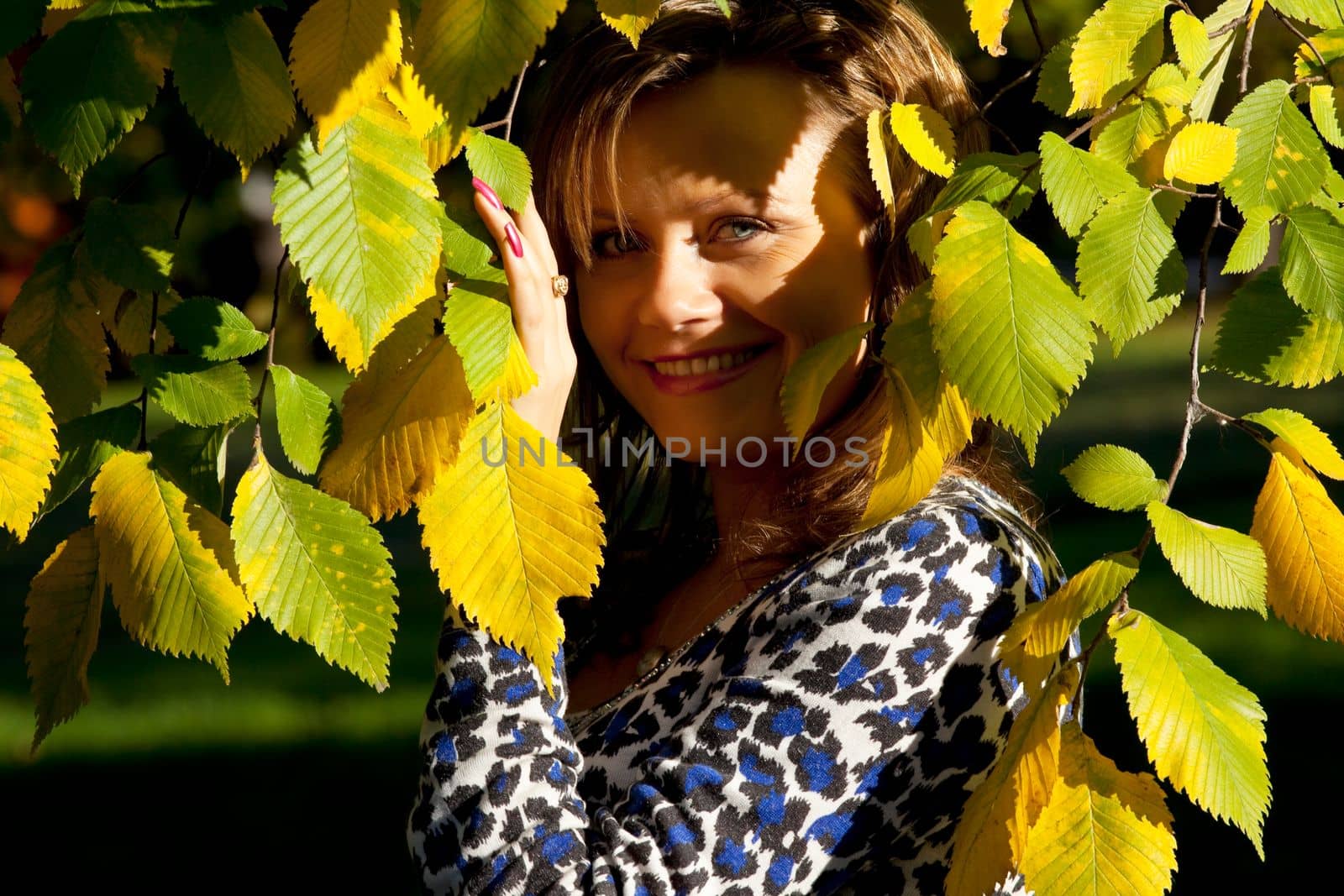 Beauty woman portrait under wutumn tree by rivertime