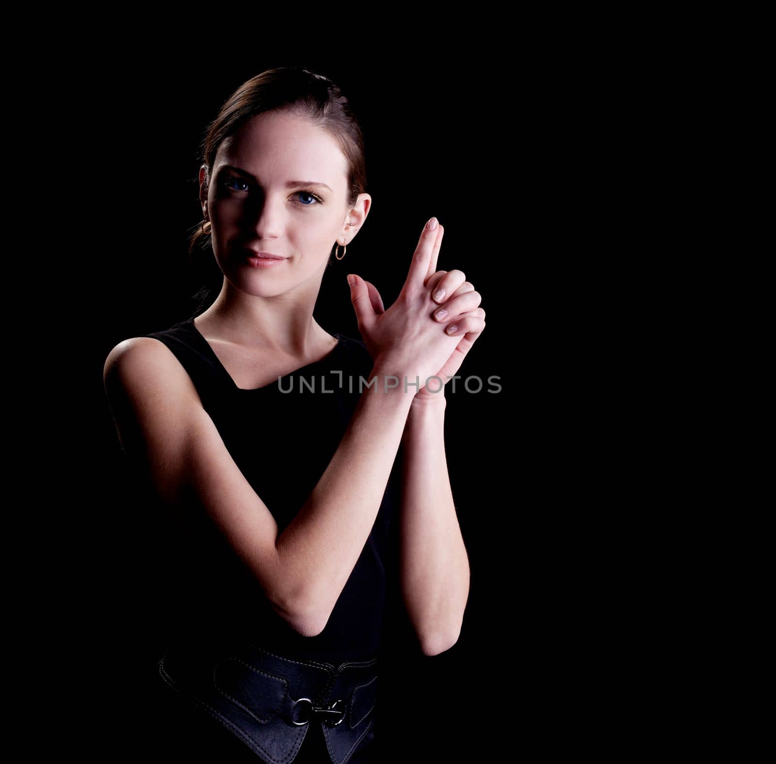 Young woman portrait with hands in gun sign