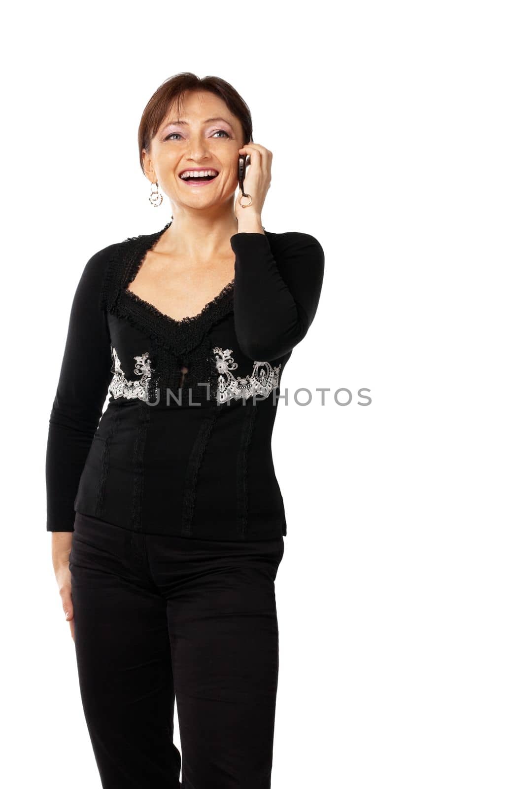 Mature woman in lace jacket tell on cell phone and smile