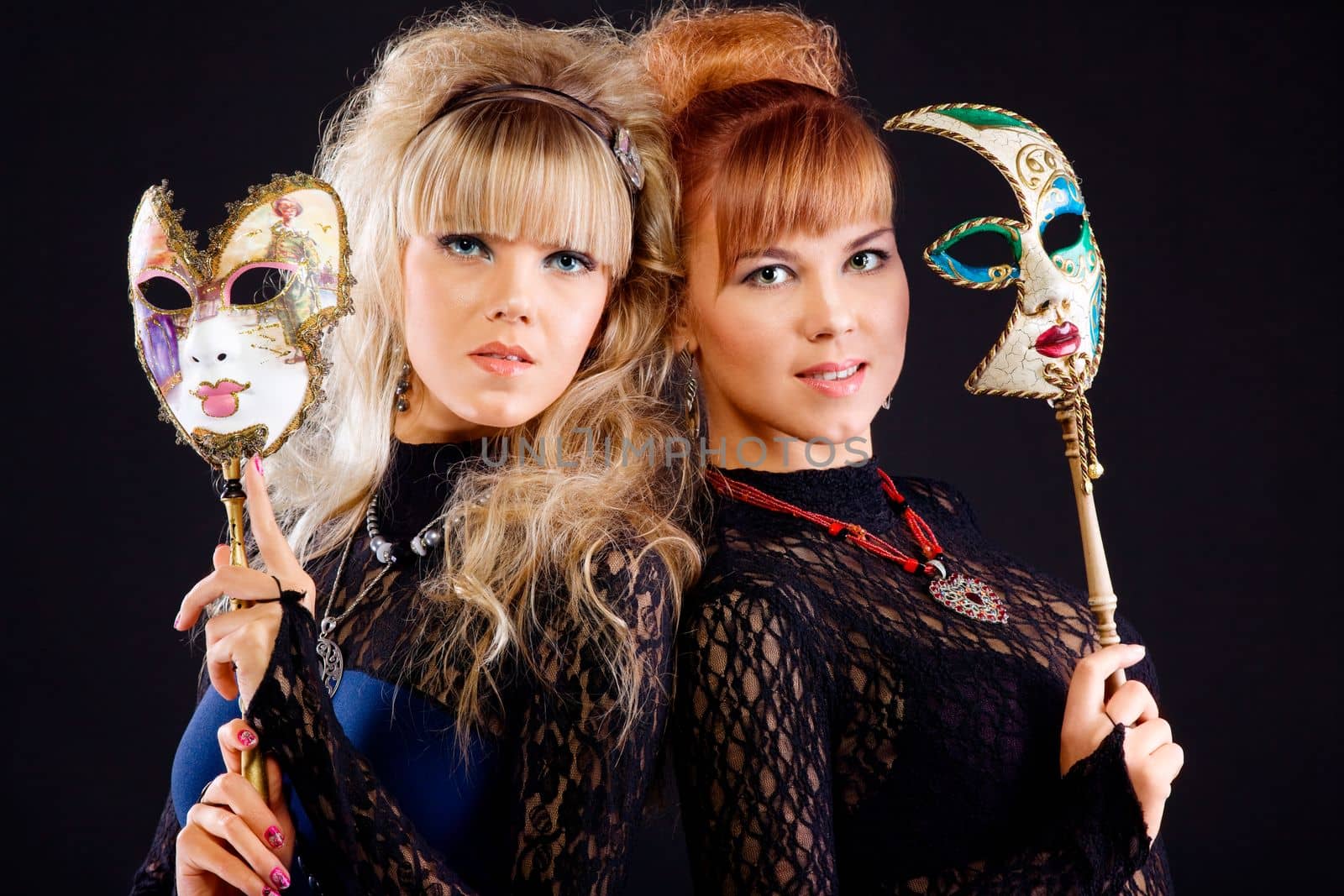 Two young beauty sisters with venice mask