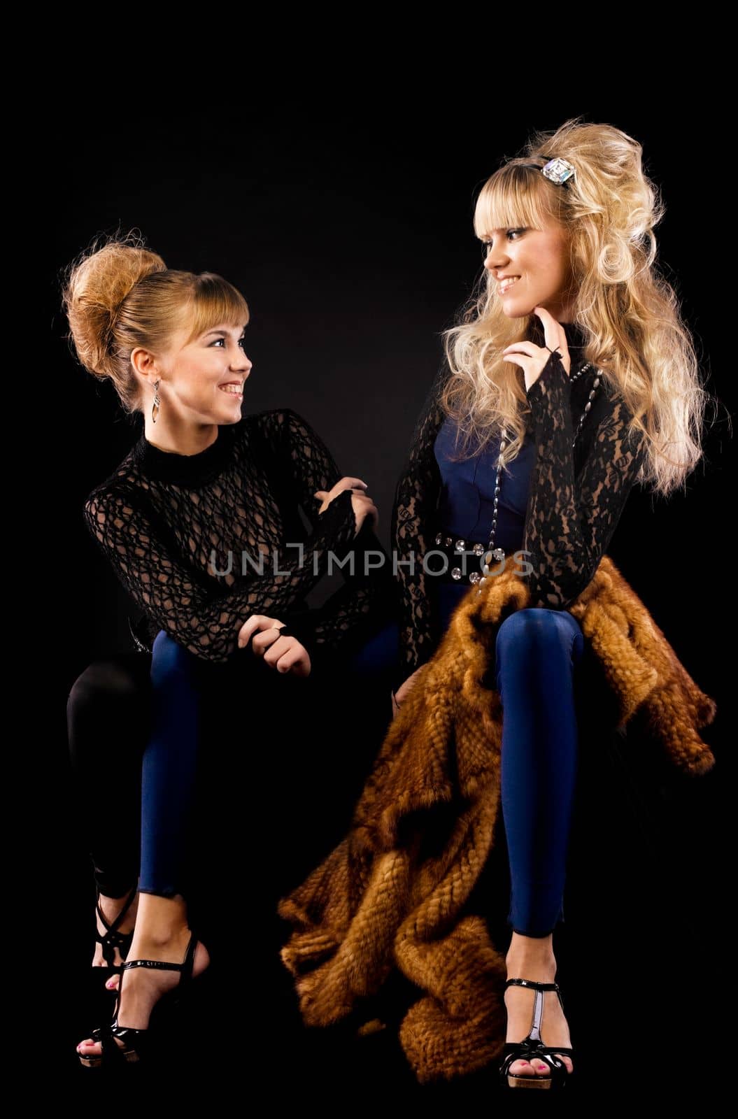 Two pretty sisters talk in lace costume