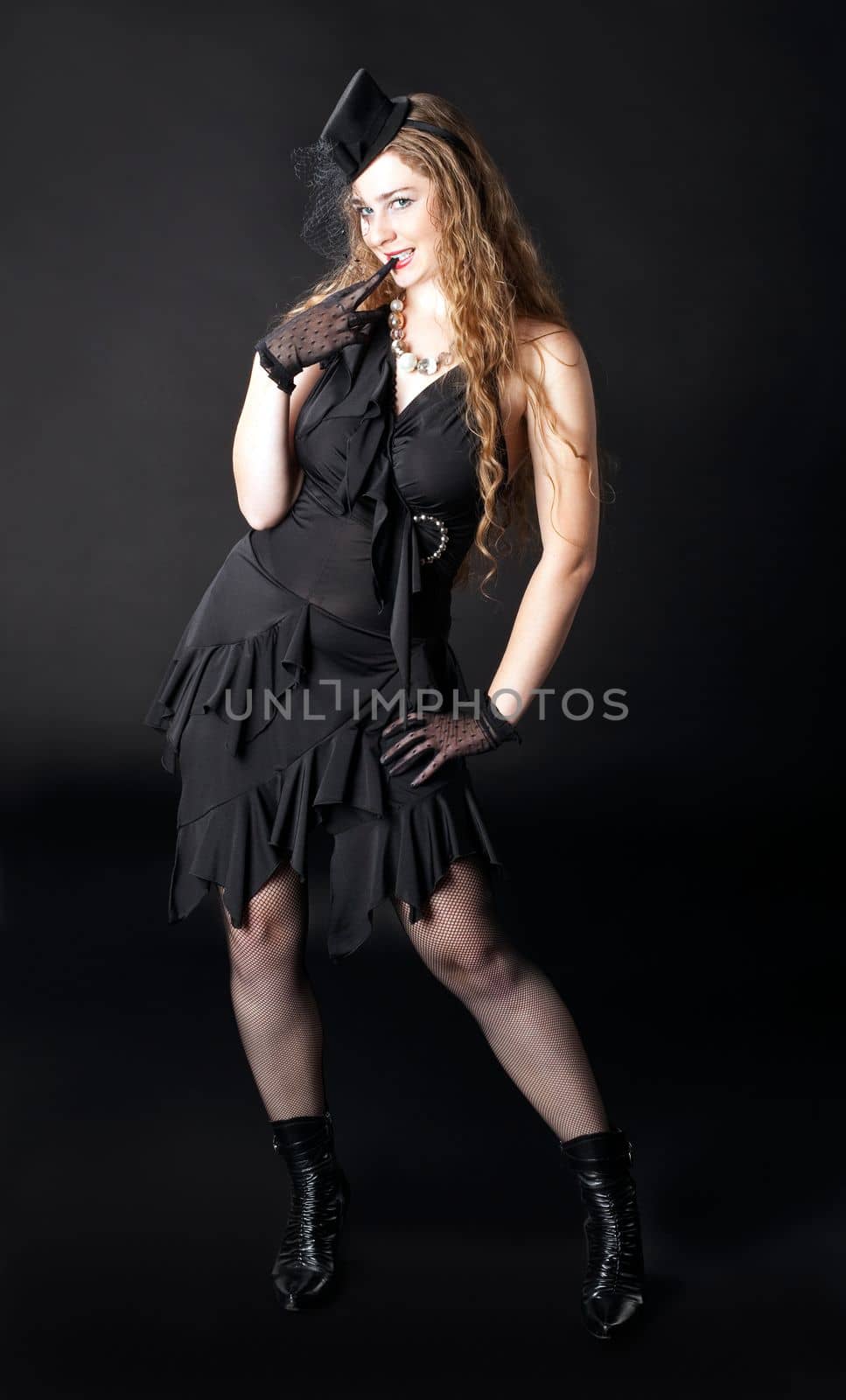 woman posing in hat on black - cabaret style