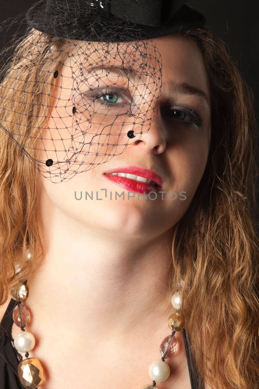 woman posing in hat on black - cabaret style