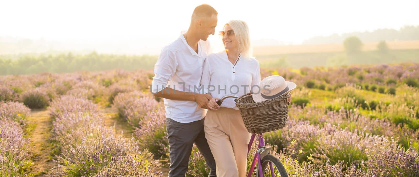 Beautiful couple on the lavender field.