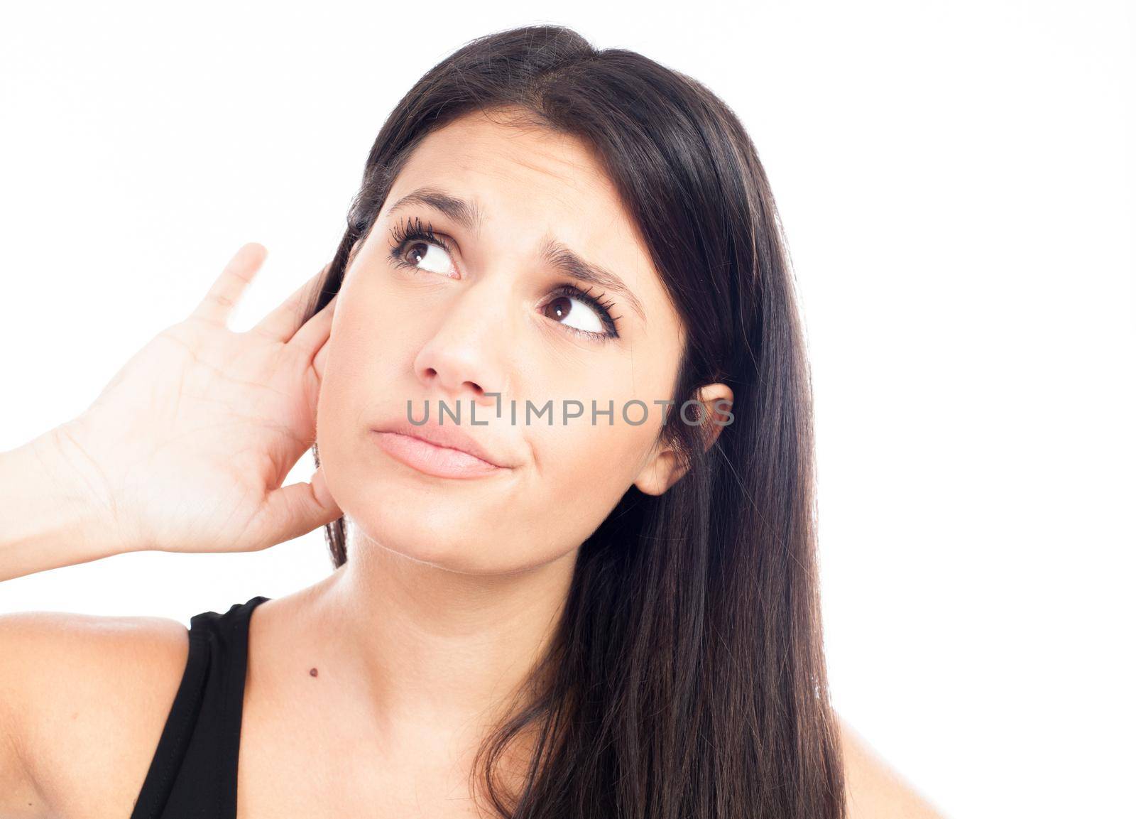 Young woman trying to listen something