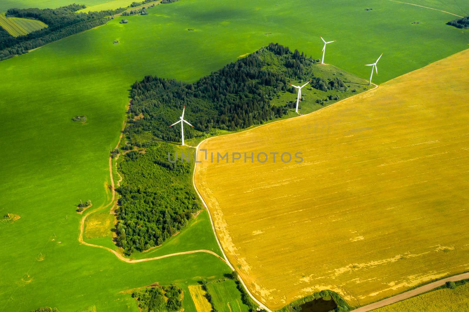 Windmills on the background of forests and fields. Windmill in nature.Belarus.