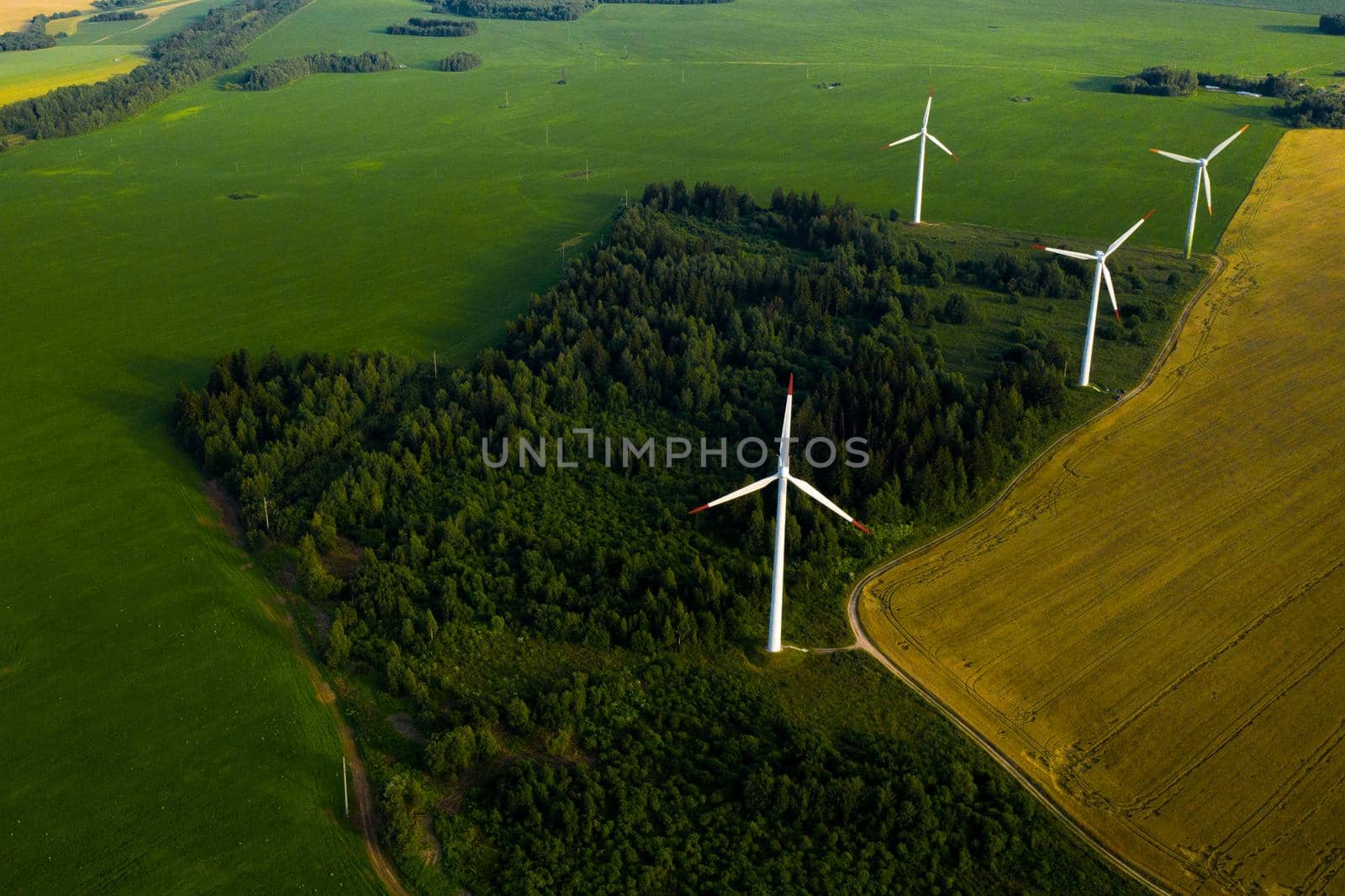 Windmills on the background of forests and fields. Windmill in nature.Belarus.