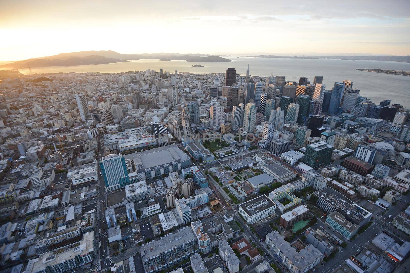 an aerial view of downtown san francisco during sunset