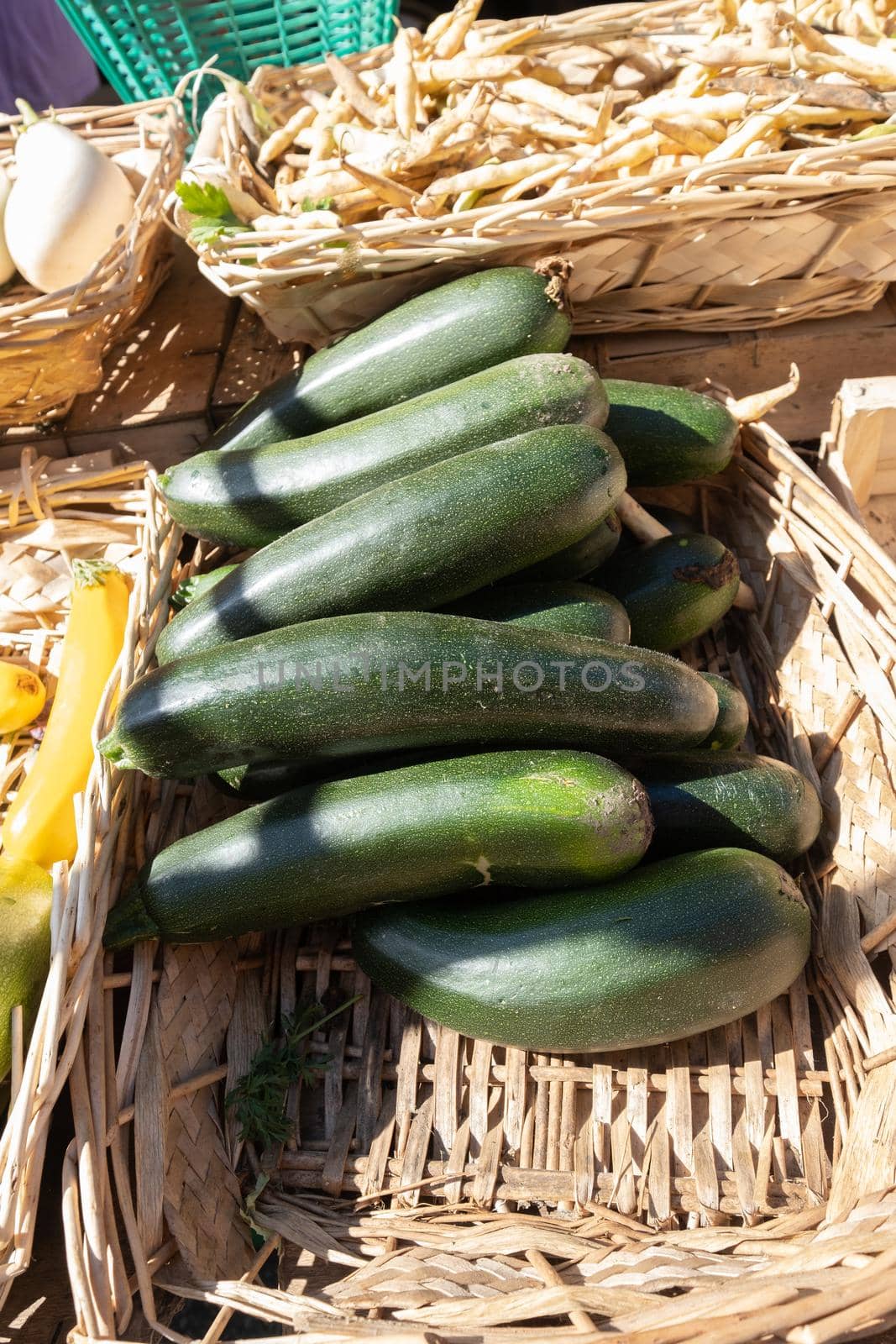 organic zucchini on a stall of a small farmers market