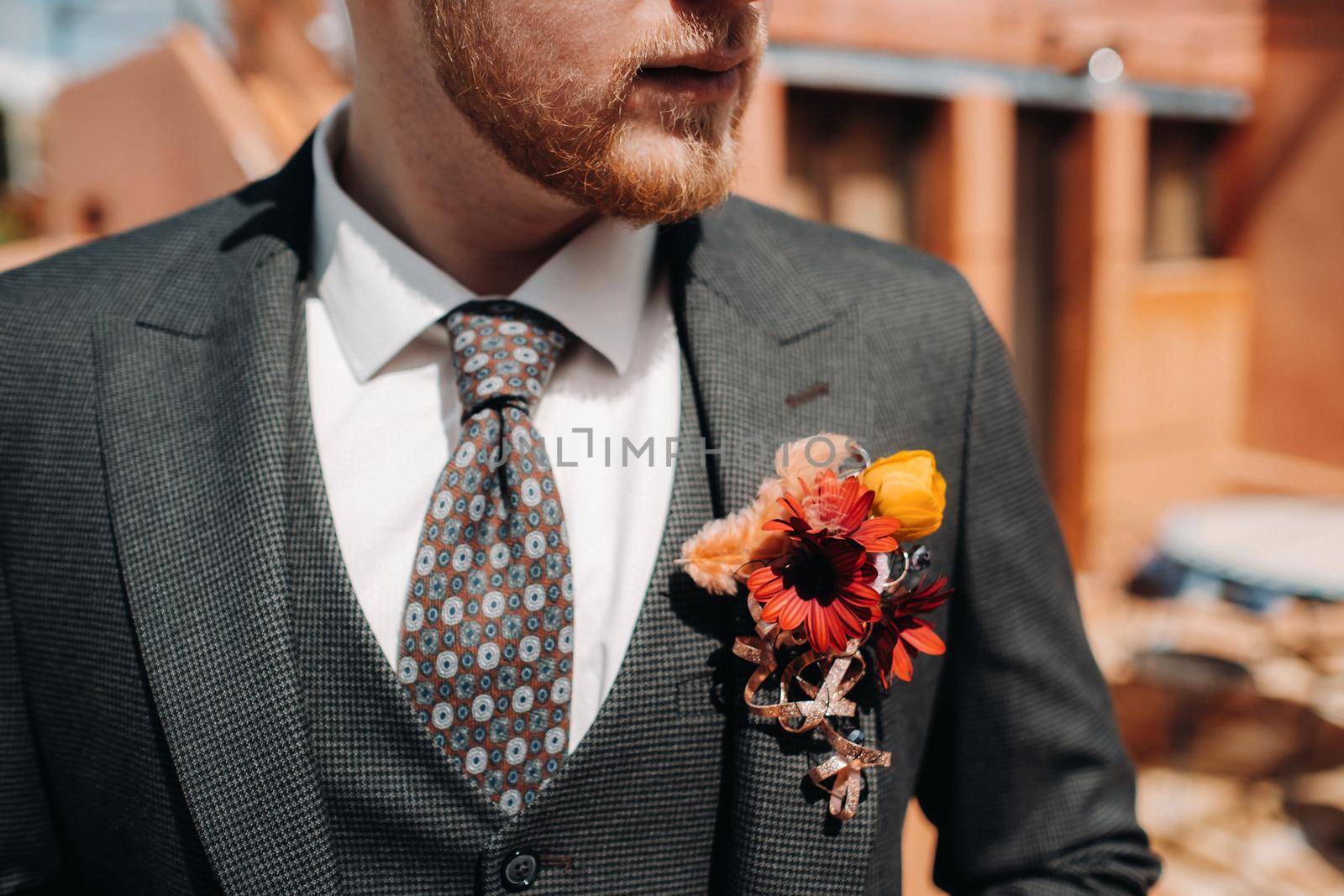 Groom in a jacket and boutonniere close-up.Groom close-up in Provence, France, the groom's fees. by Lobachad