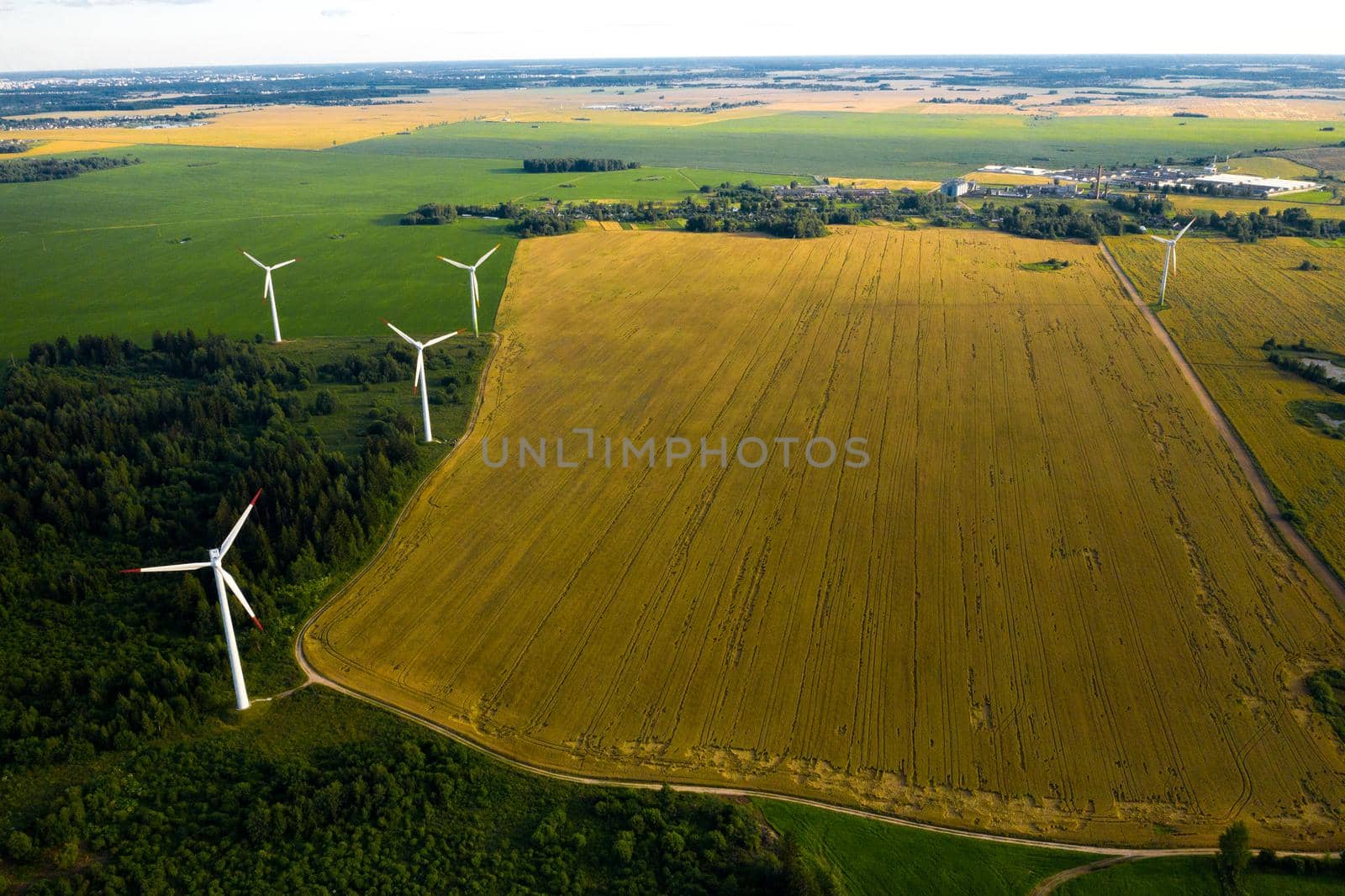 Windmills on the background of forests and fields. Windmill in nature.Belarus.