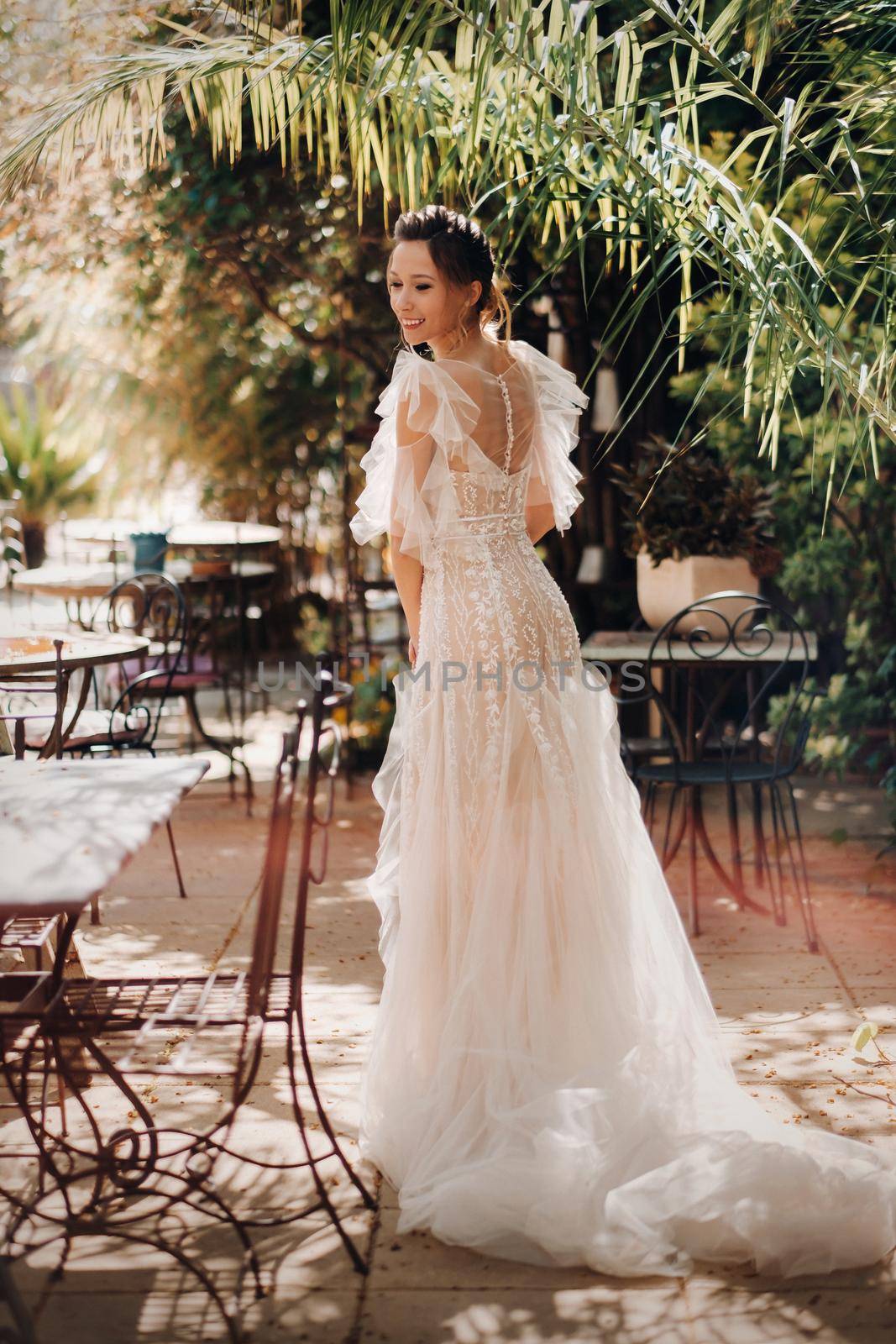 a beautiful bride with pleasant features in a wedding dress is photographed in Provence. Portrait of the bride in France.